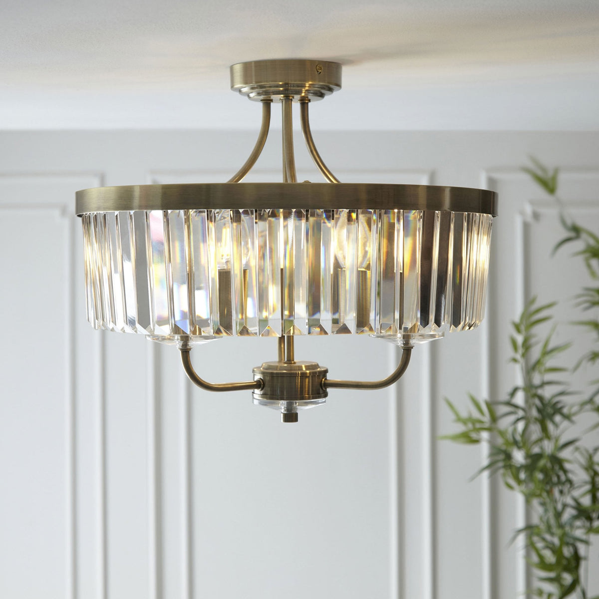 A close-up shot of the stunning Tiffany round semi-flush ceiling light with crystal detailing and brass fixtures.