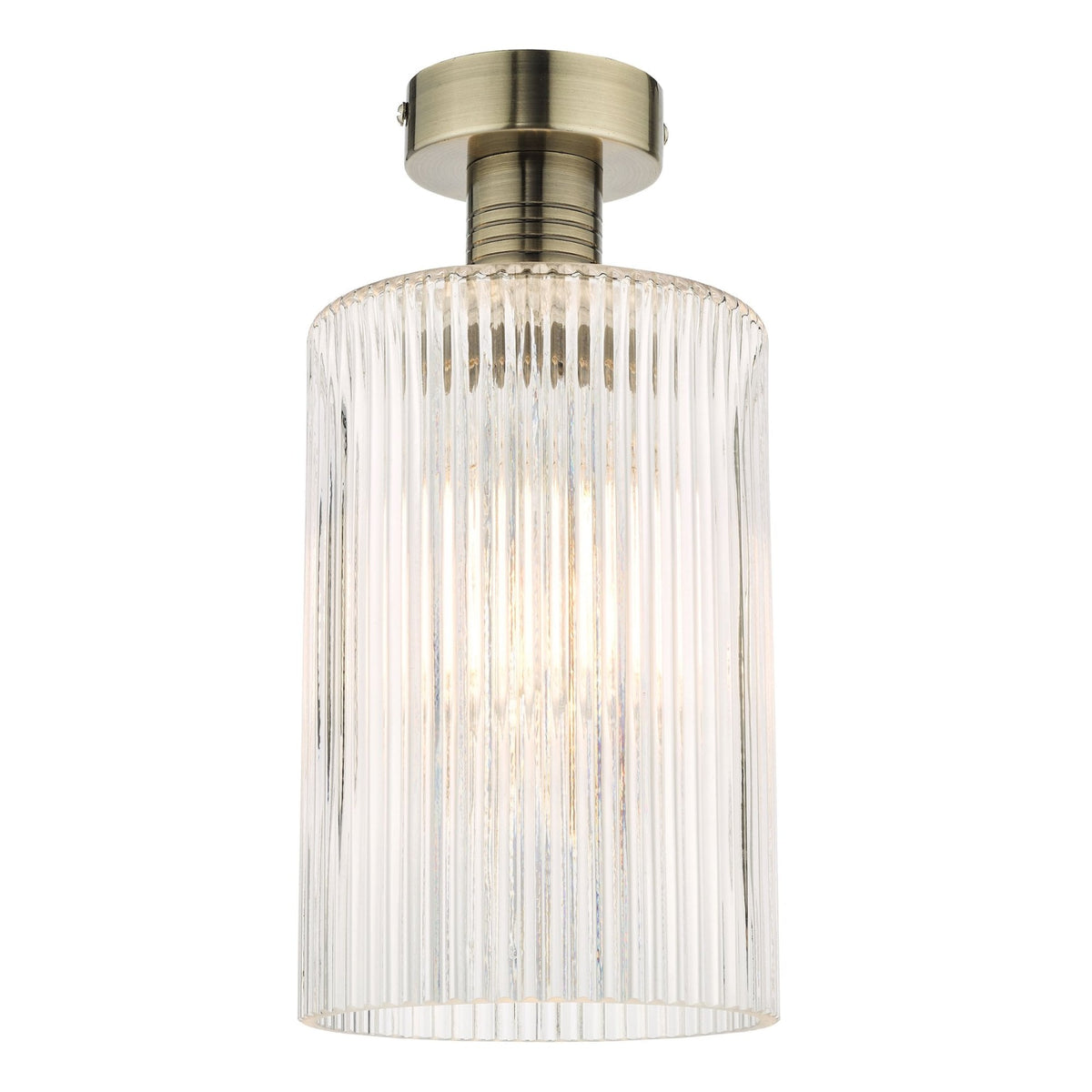 A modern ceiling light with a ribbed glass shade and an antique brass base.
