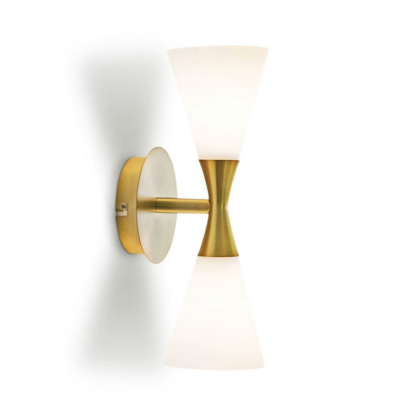 A sleek brass wall sconce with two conical frosted glass shades, one pointing up, one down.