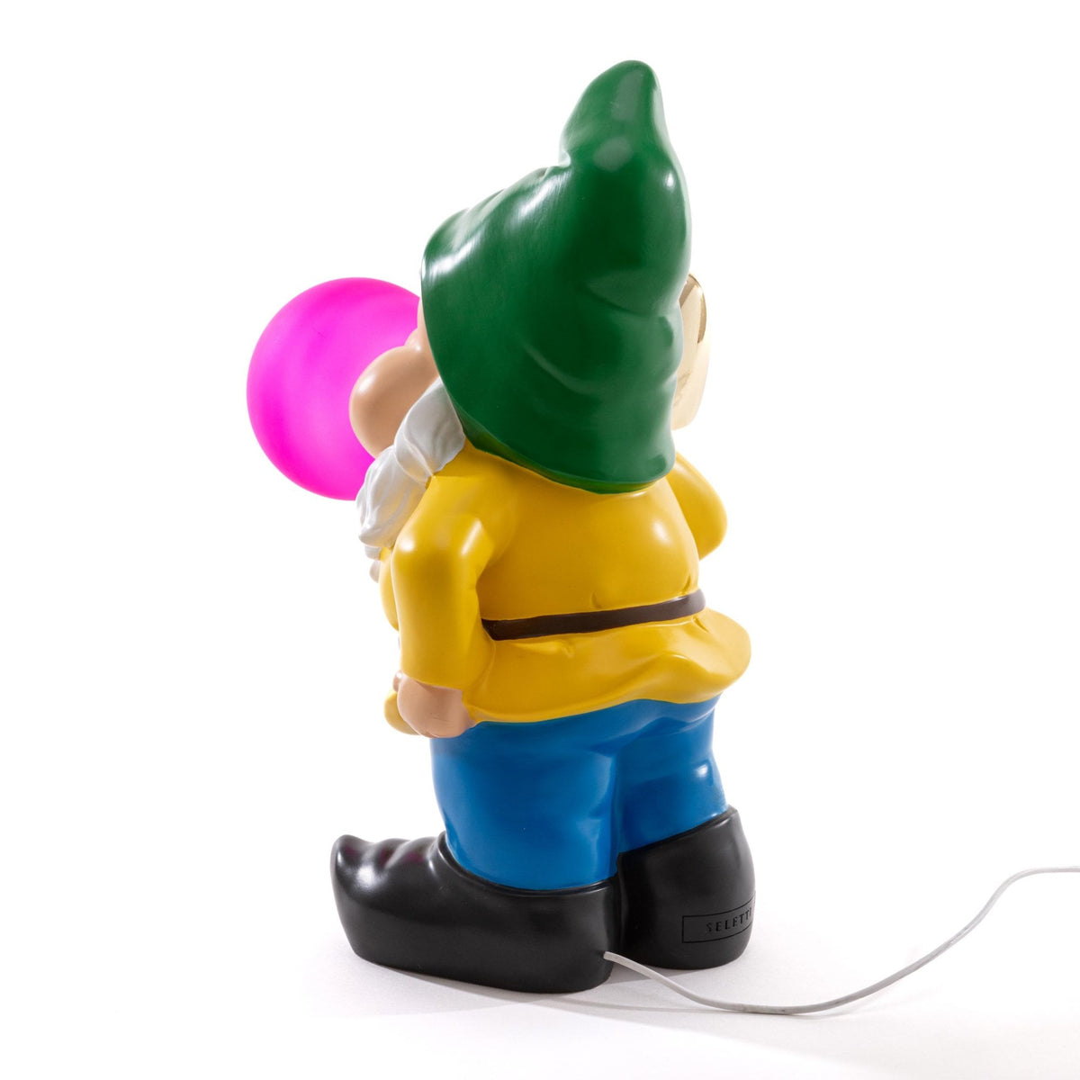 Rear view of a garden gnome blowing a glowing pink bubble gum bubble.
