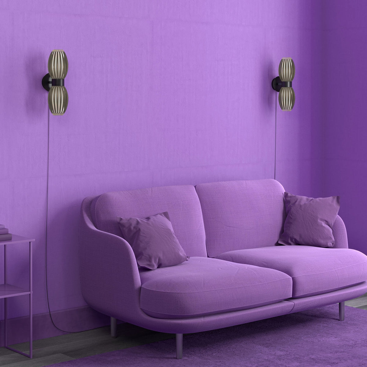 A vibrant purple living room with a sofa and two elegant wall lights on the wall.