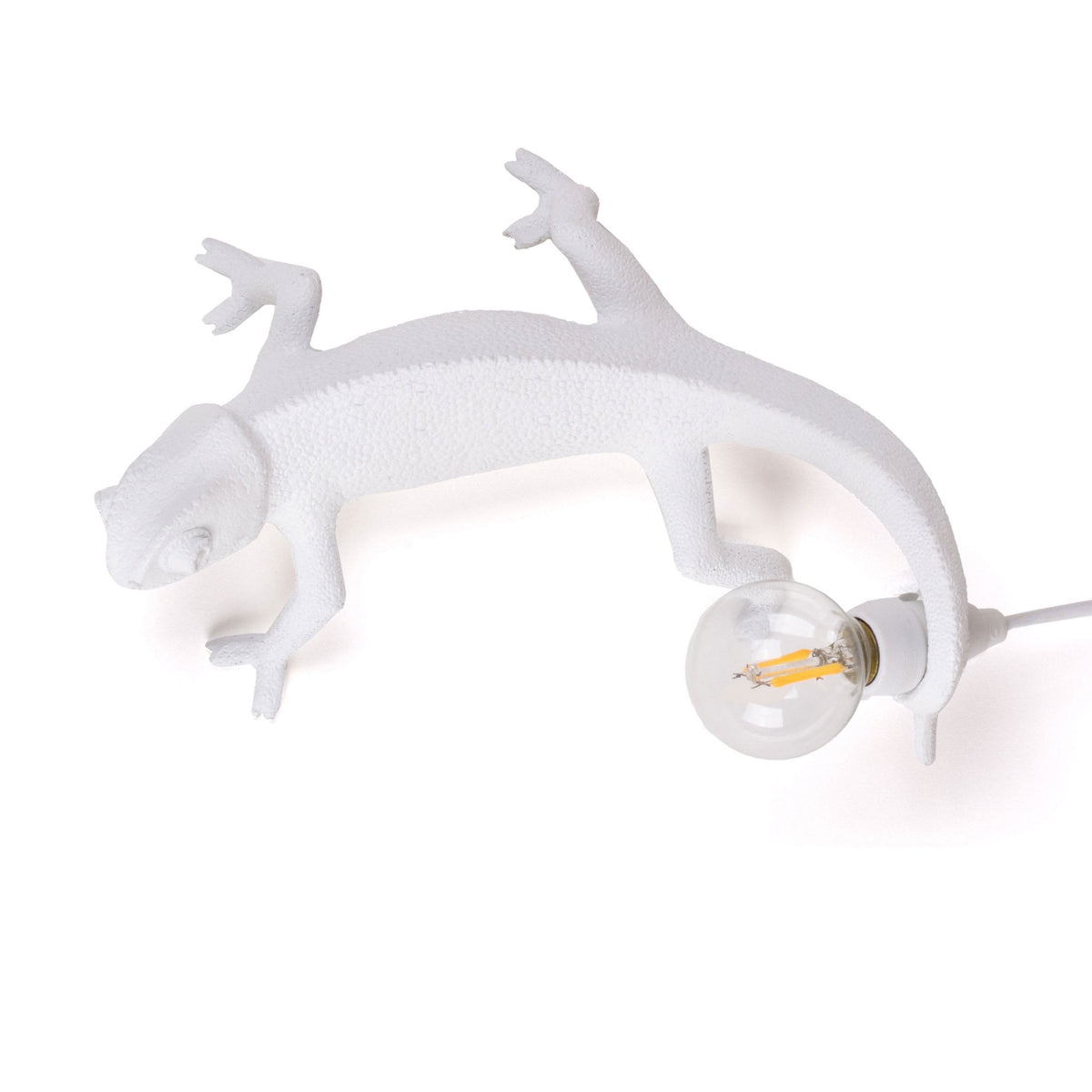 White lizard-shaped lamp with an unlit bulb, showcasing its unique design.