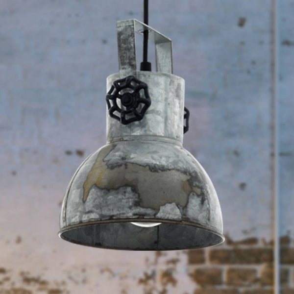A close-up of a distressed metal industrial-style pendant light with a black valve detail.