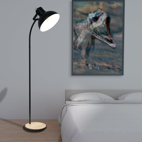 A black floor lamp with a wooden base in a bedroom with a dinosaur poster.