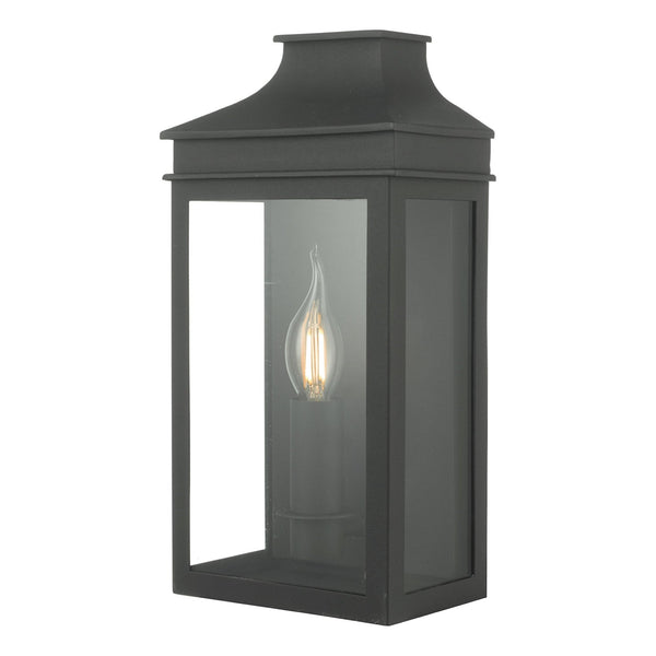 A sophisticated black outdoor wall light, featuring clear glass panels and an elegant flame-effect bulb.