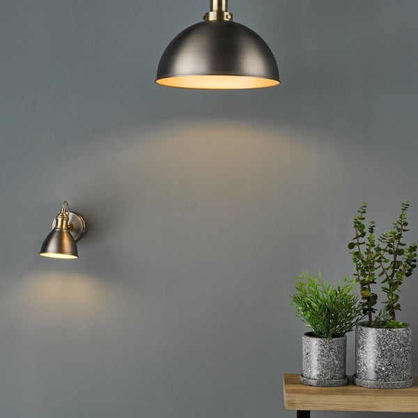 A room with the antique brass and pewter wall light and matching pendant light.