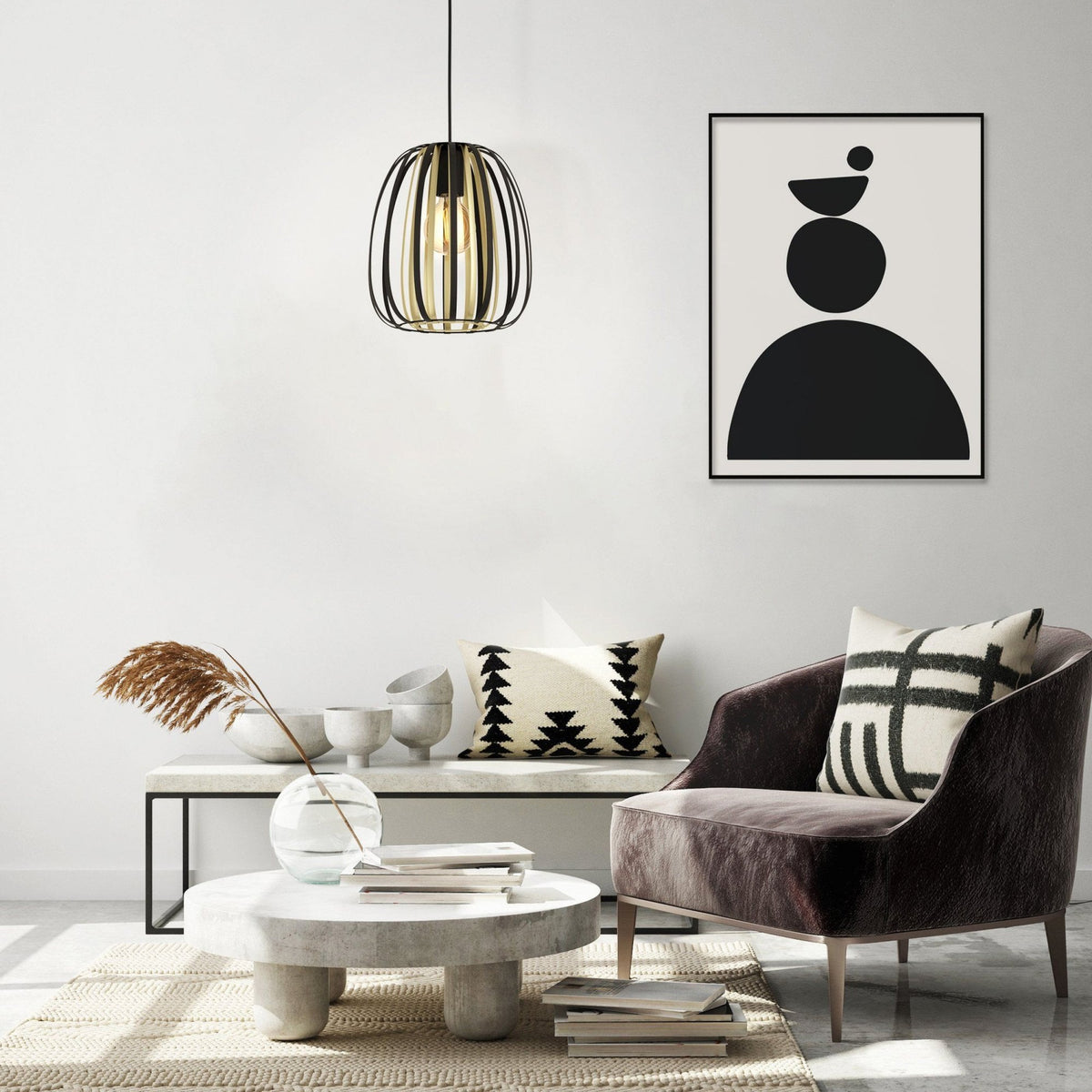 A stylish living room featuring the black and gold pendant light as a focal point.