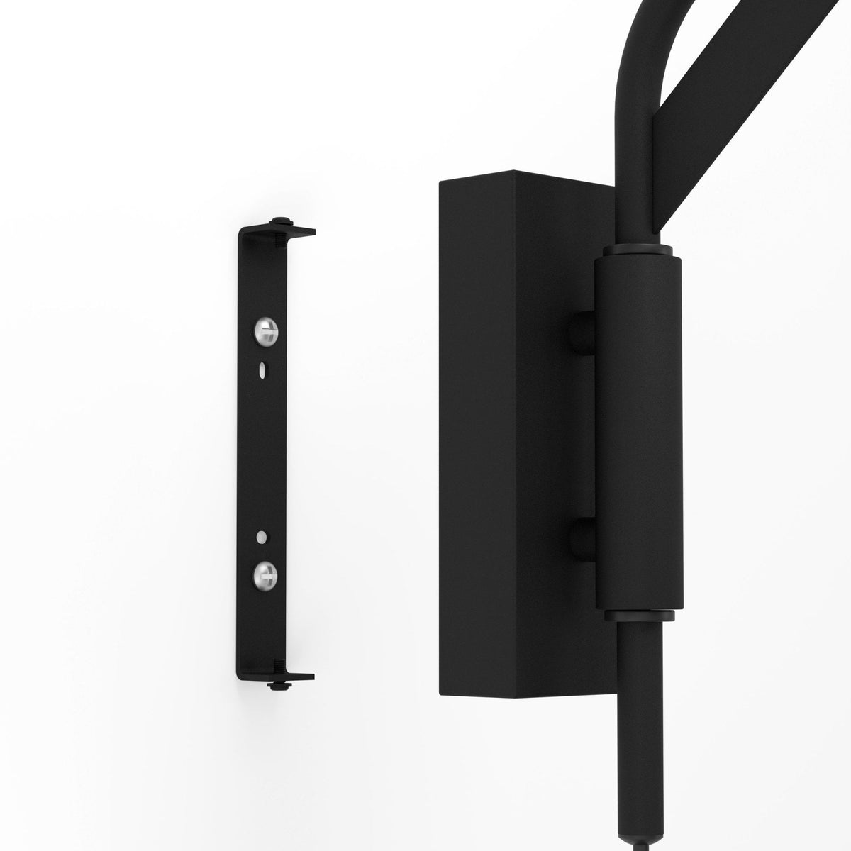 Close-up of the mounting bracket for a black wall lamp, showing installation hardware.