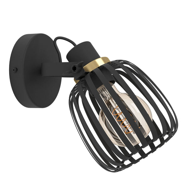 A black metal caged wall light with a gold accent and exposed bulb.
