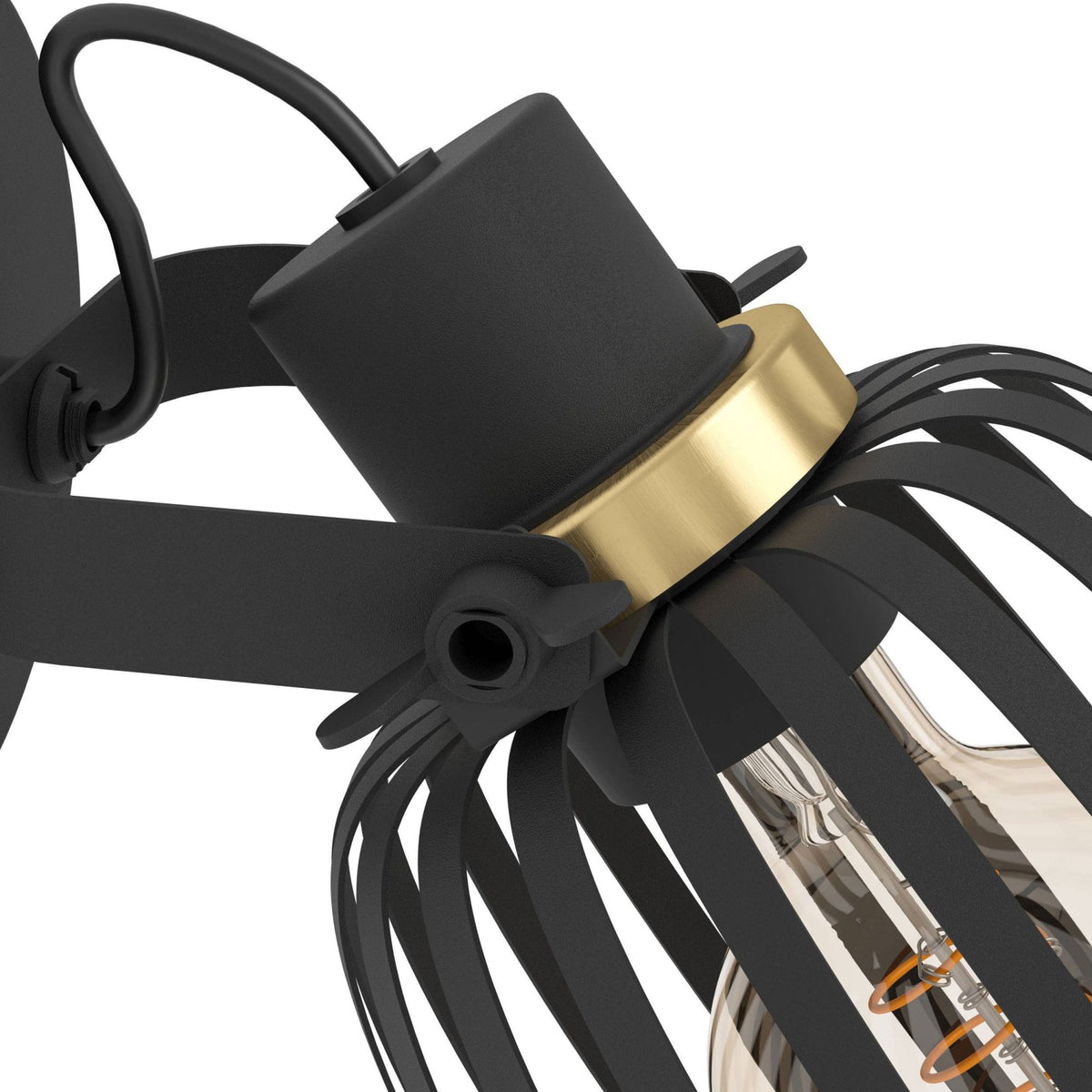 A close-up of the adjustable joint and gold accent on a black caged light.