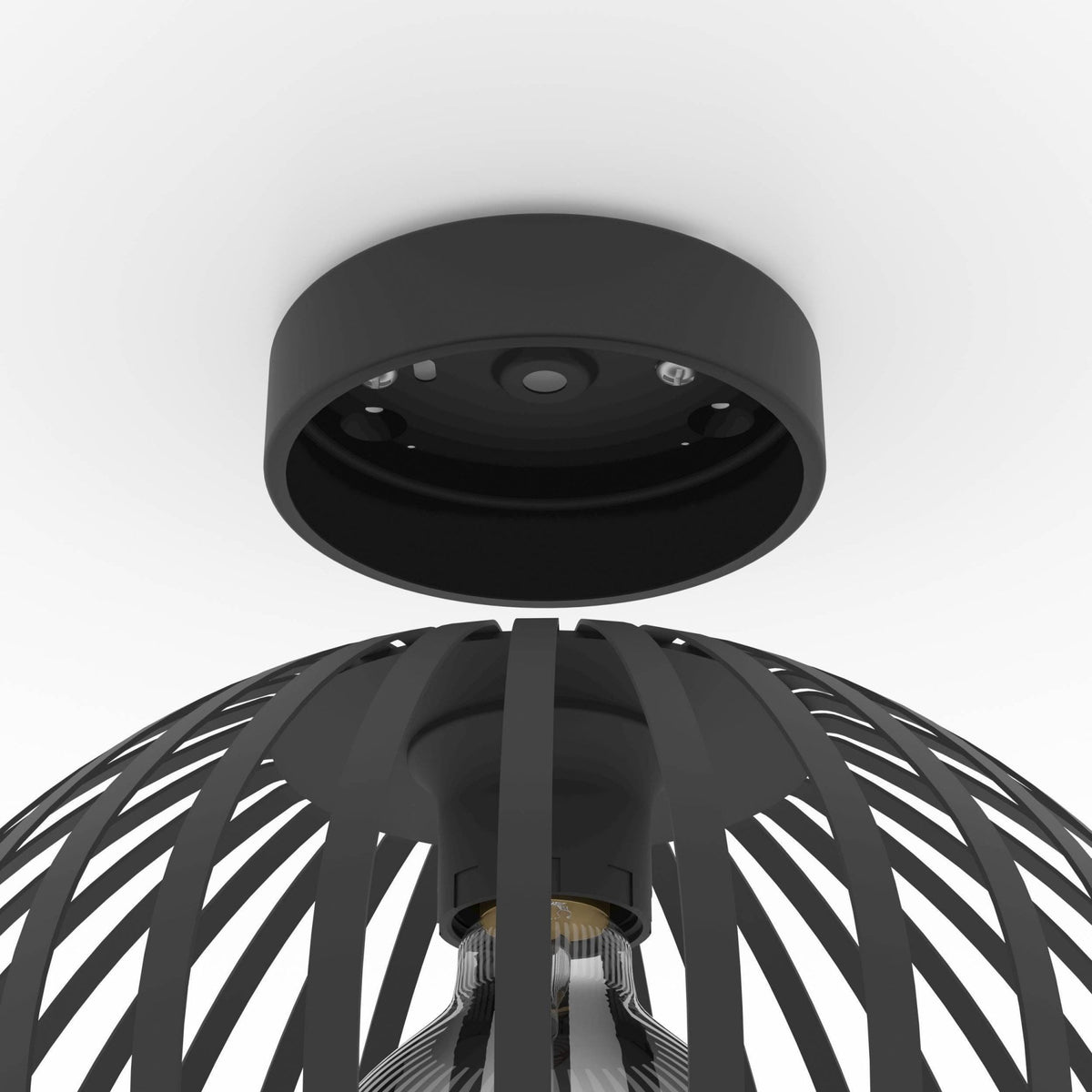 A close-up showing the fixture and the top of the black dome-shaped cage ceiling light.