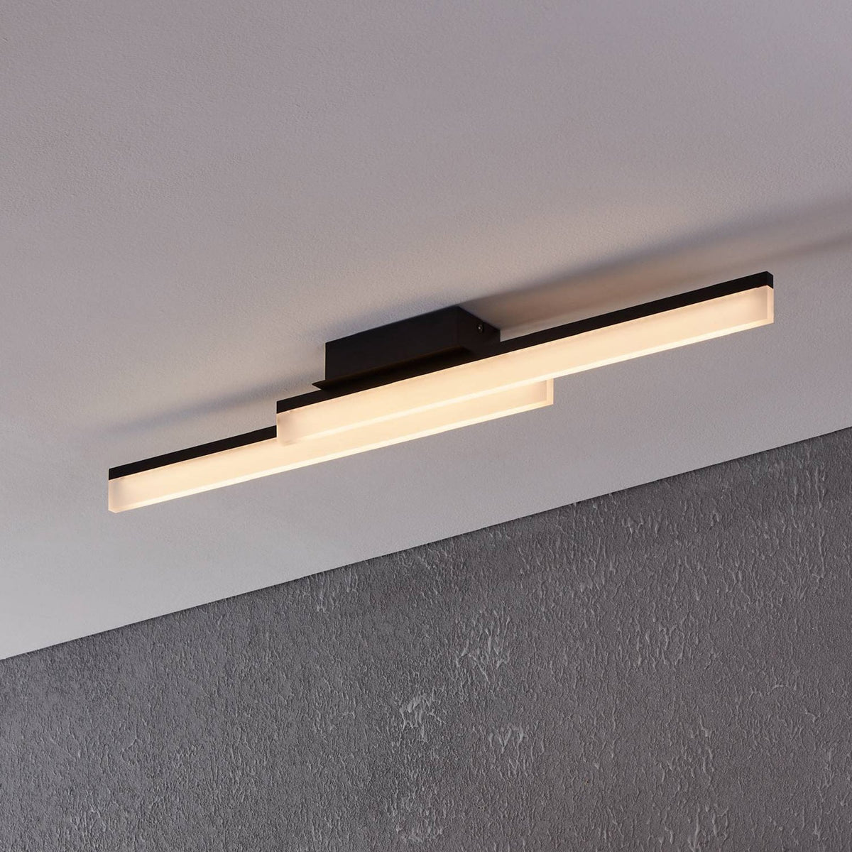 Linear LED ceiling light in black finish, with two long rectangular bars of light.