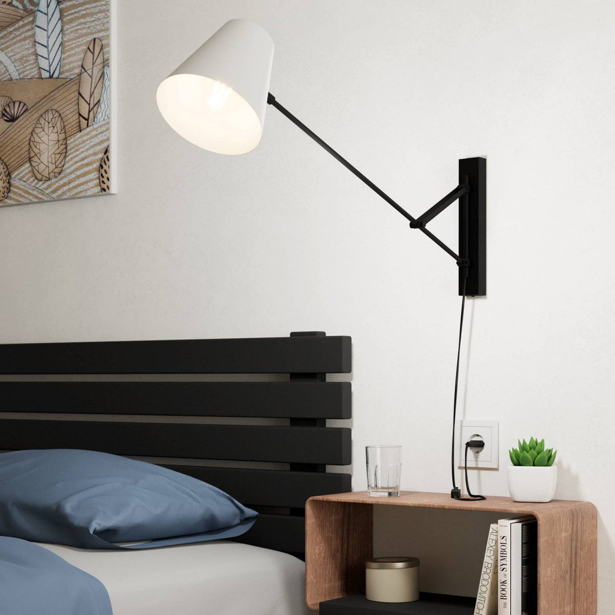 A white cone-shaped wall light with an adjustable black arm, mounted above a wooden bedside table.