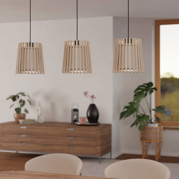 Three wooden slat pendant lights illuminating a modern dining area.