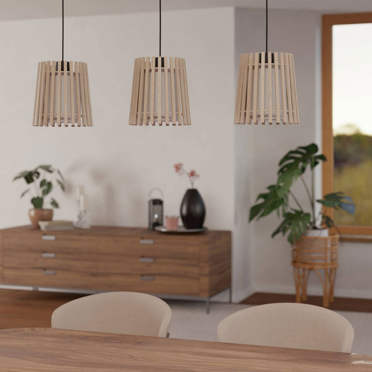 Modern dining room with three wooden pendant lights hanging over a table.