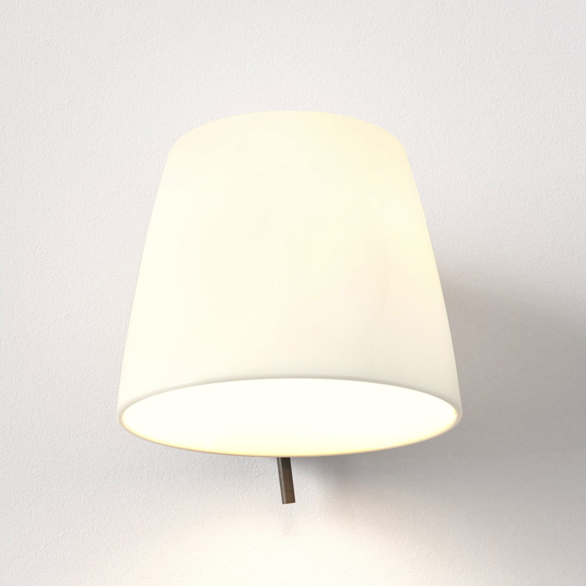 White conical wall sconce with a bronze arm