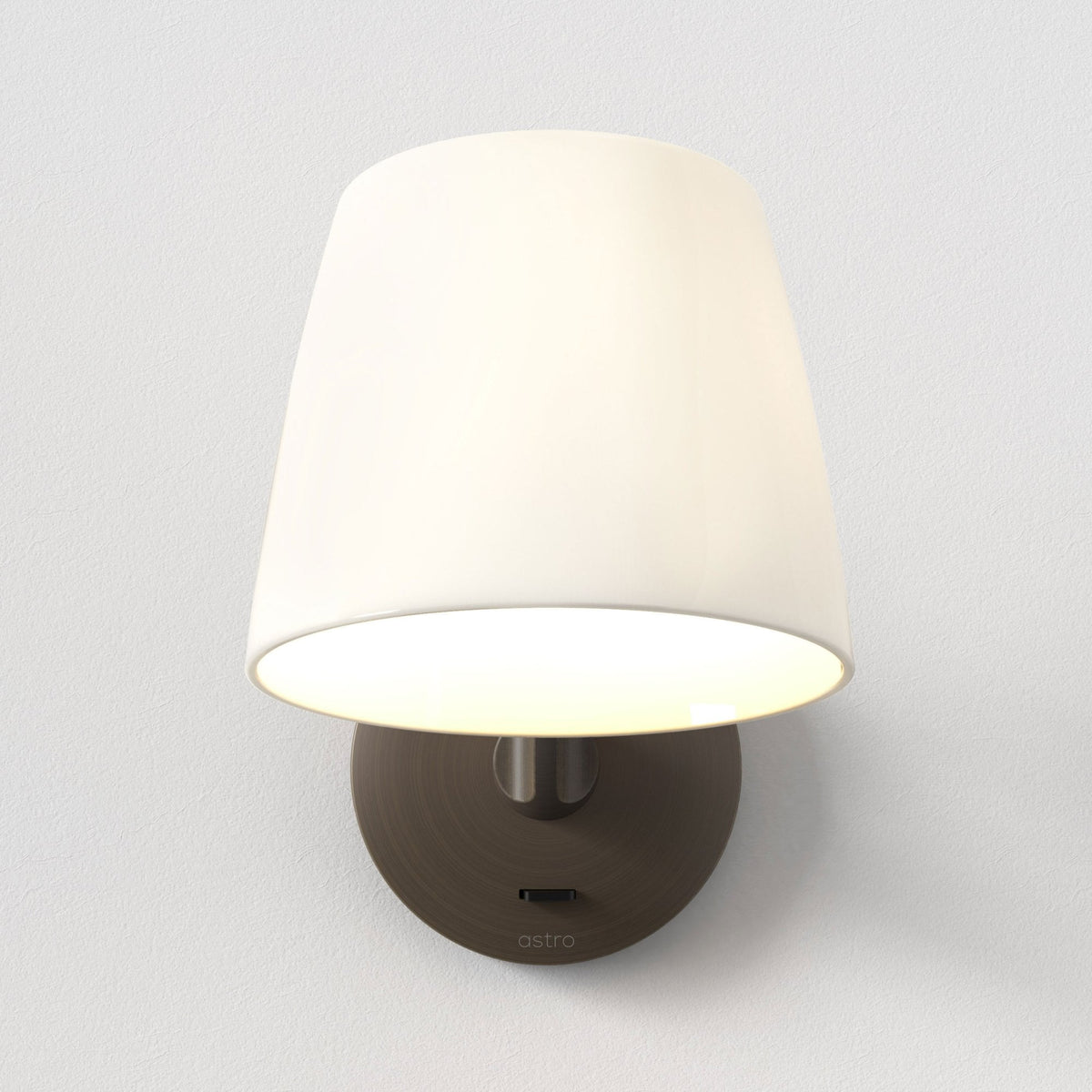 Astro white wall light with a bronze base and a small black switch