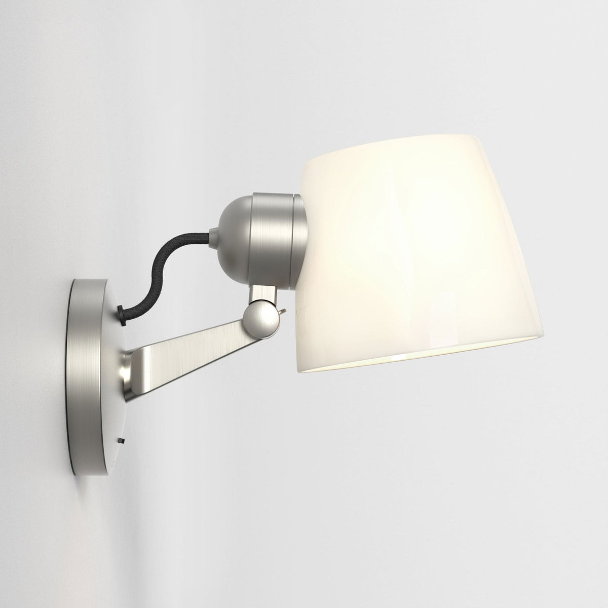 Brushed steel wall lamp with a white conical shade