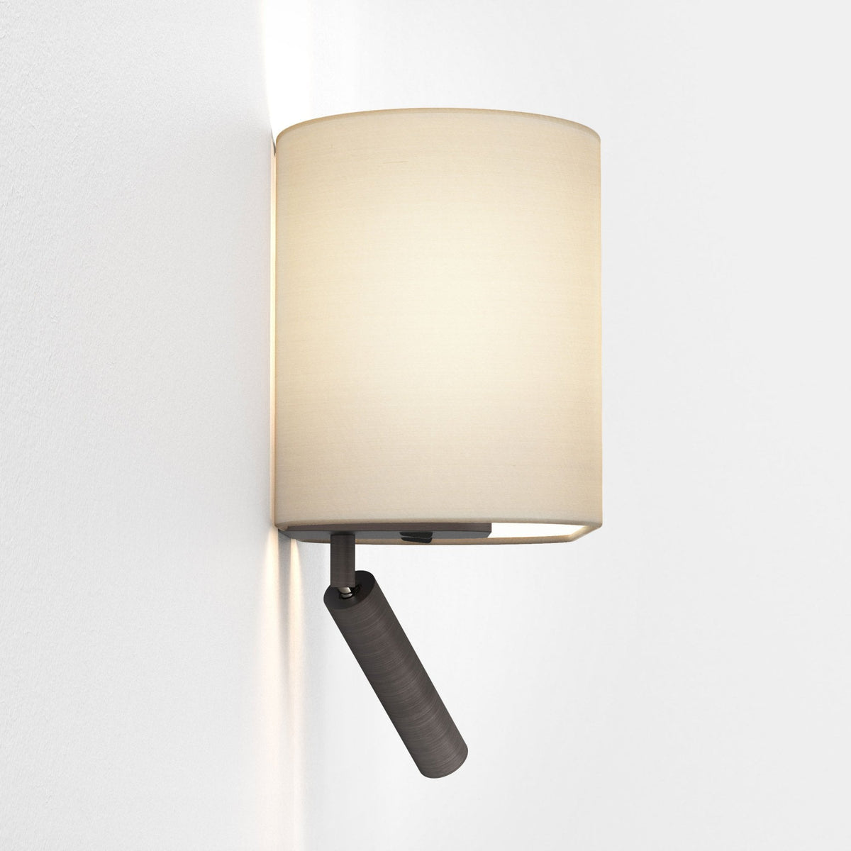 Wall-mounted lamp with a cylindrical fabric shade and an adjustable dark metal spotlight below