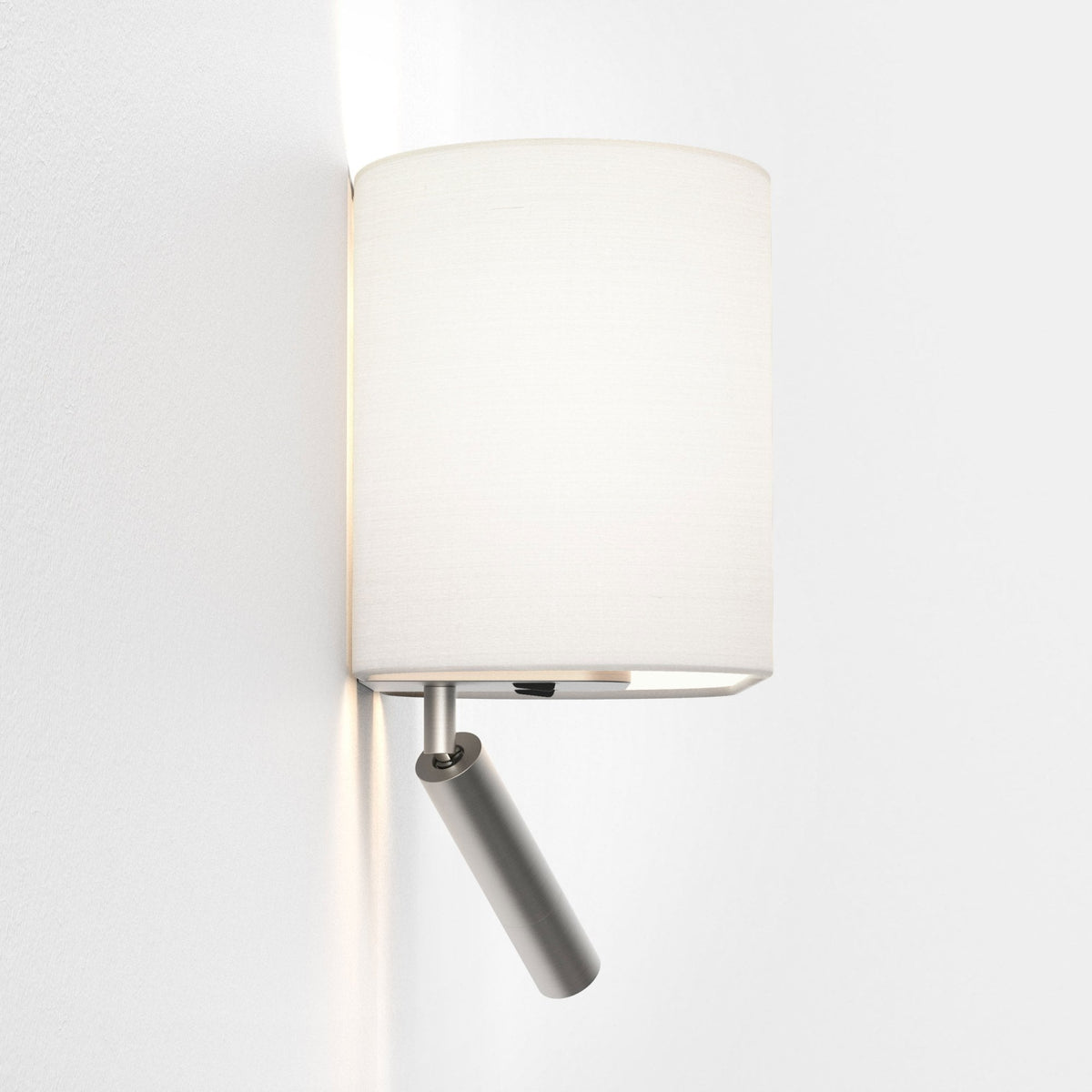Wall-mounted lamp with a cylindrical white fabric shade and an adjustable brushed metal spotlight below