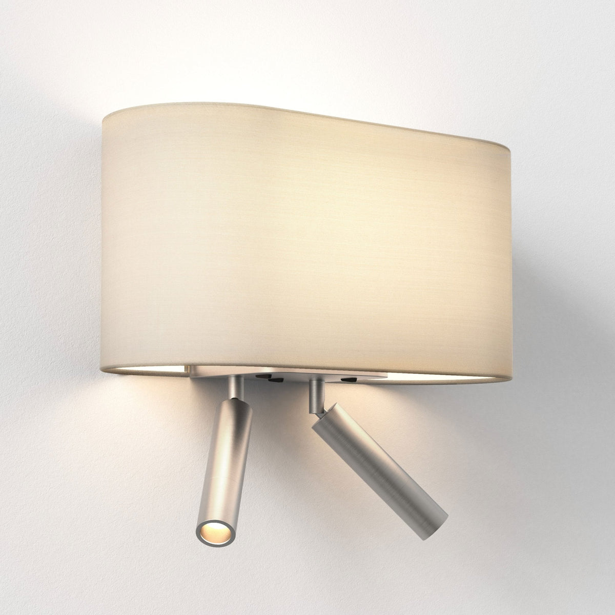 Wall-mounted light fixture with an oval fabric shade and two adjustable metal spotlights below