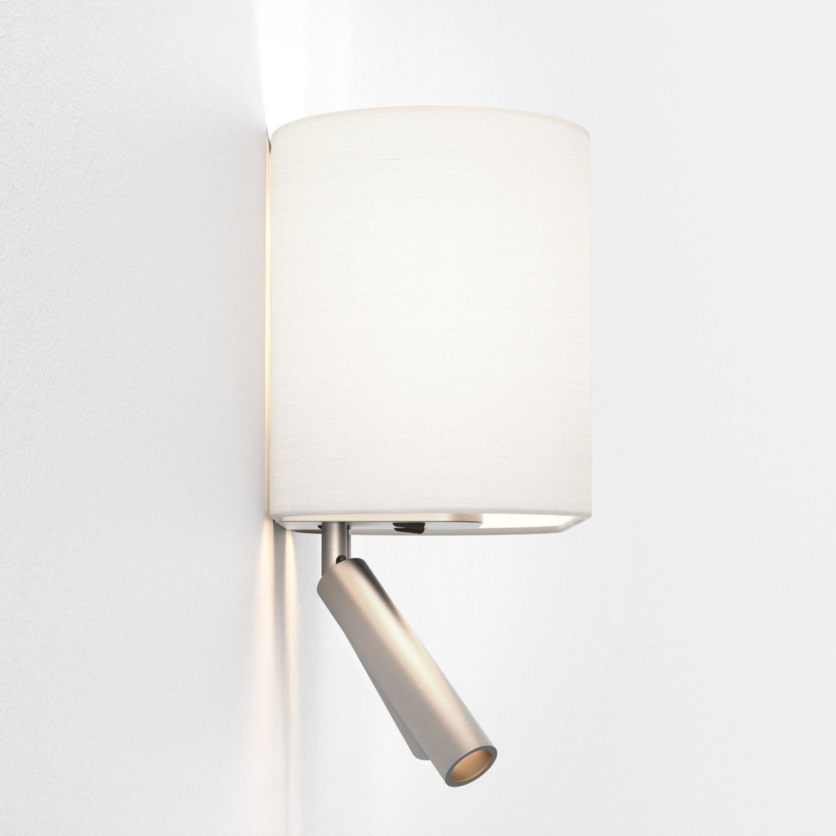 Wall mounted lamp with a white cylindrical shade and an adjustable brushed metal spotlight