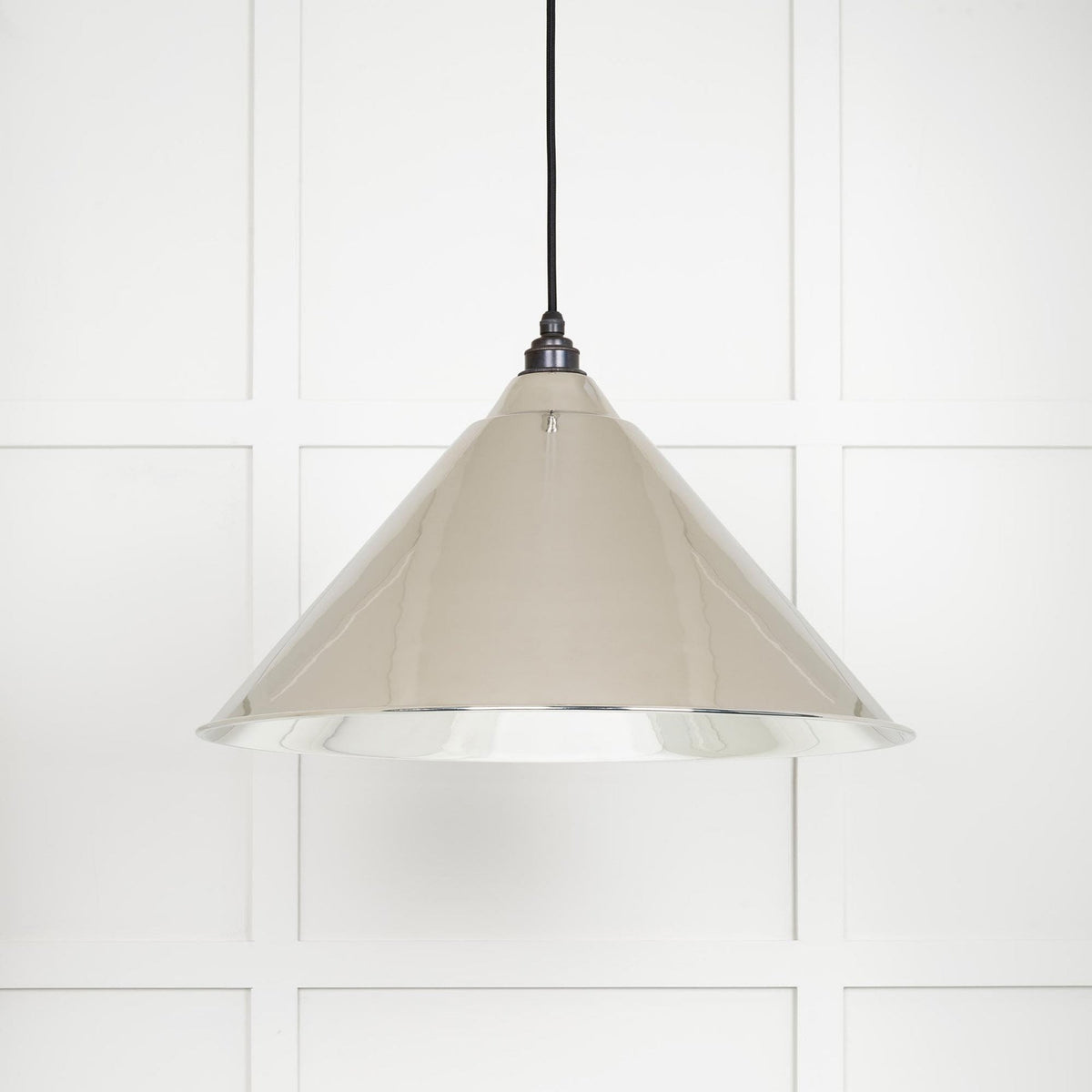 A beige pendant light, perfect for adding a warm glow to any room.