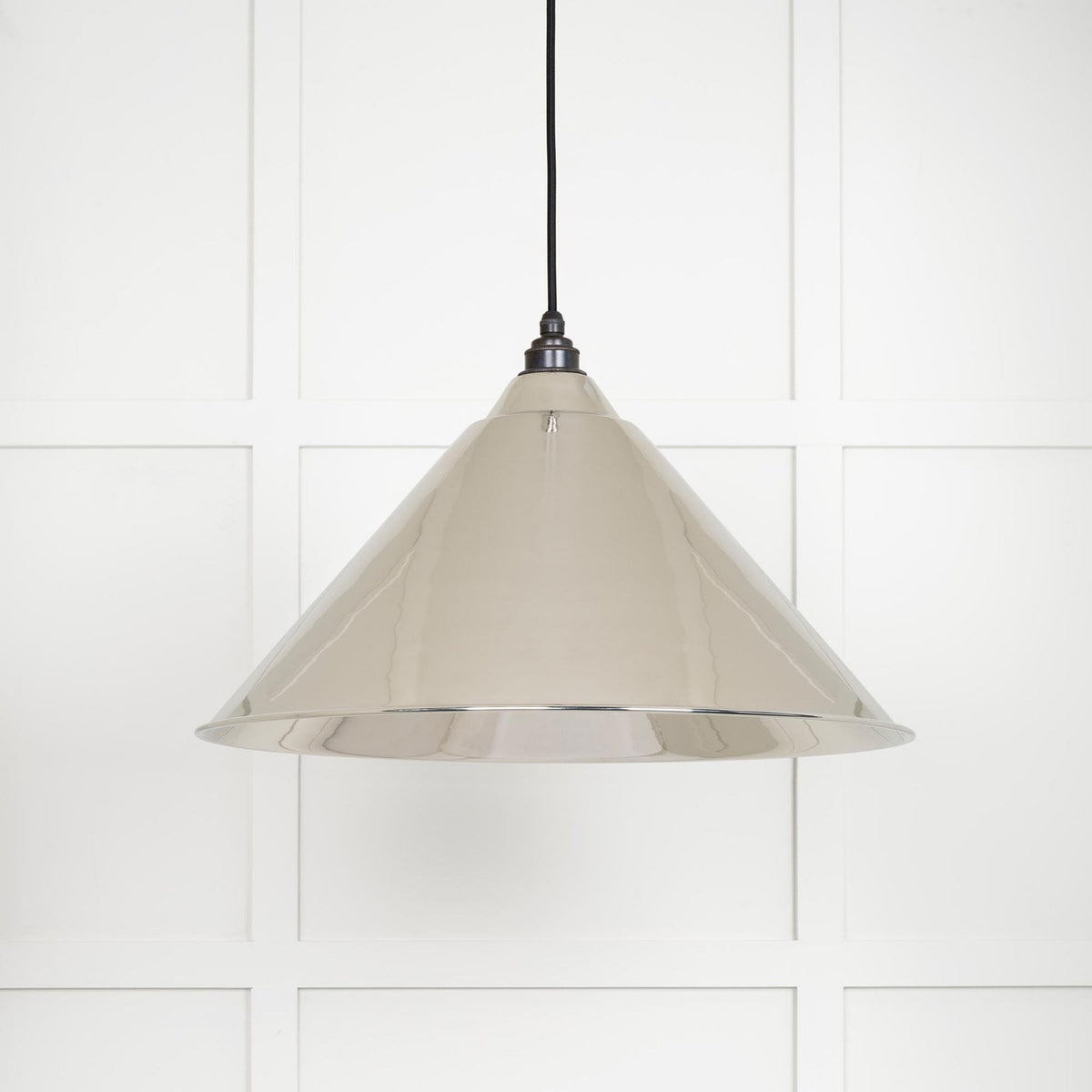 The sophisticated beige pendant light, ideal for a refined home aesthetic.