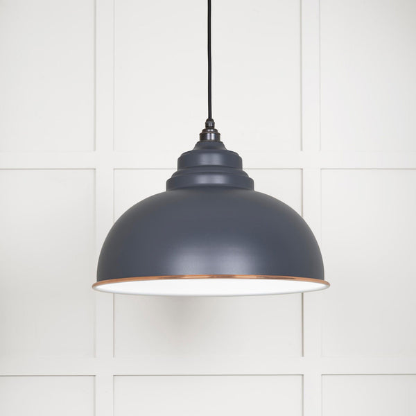 A close up of the Oxford pendant light against a white panelled wall.