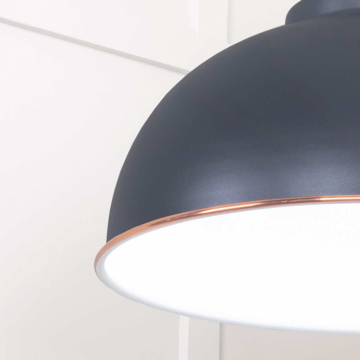 A close up of the copper trim on the Oxford pendant light.