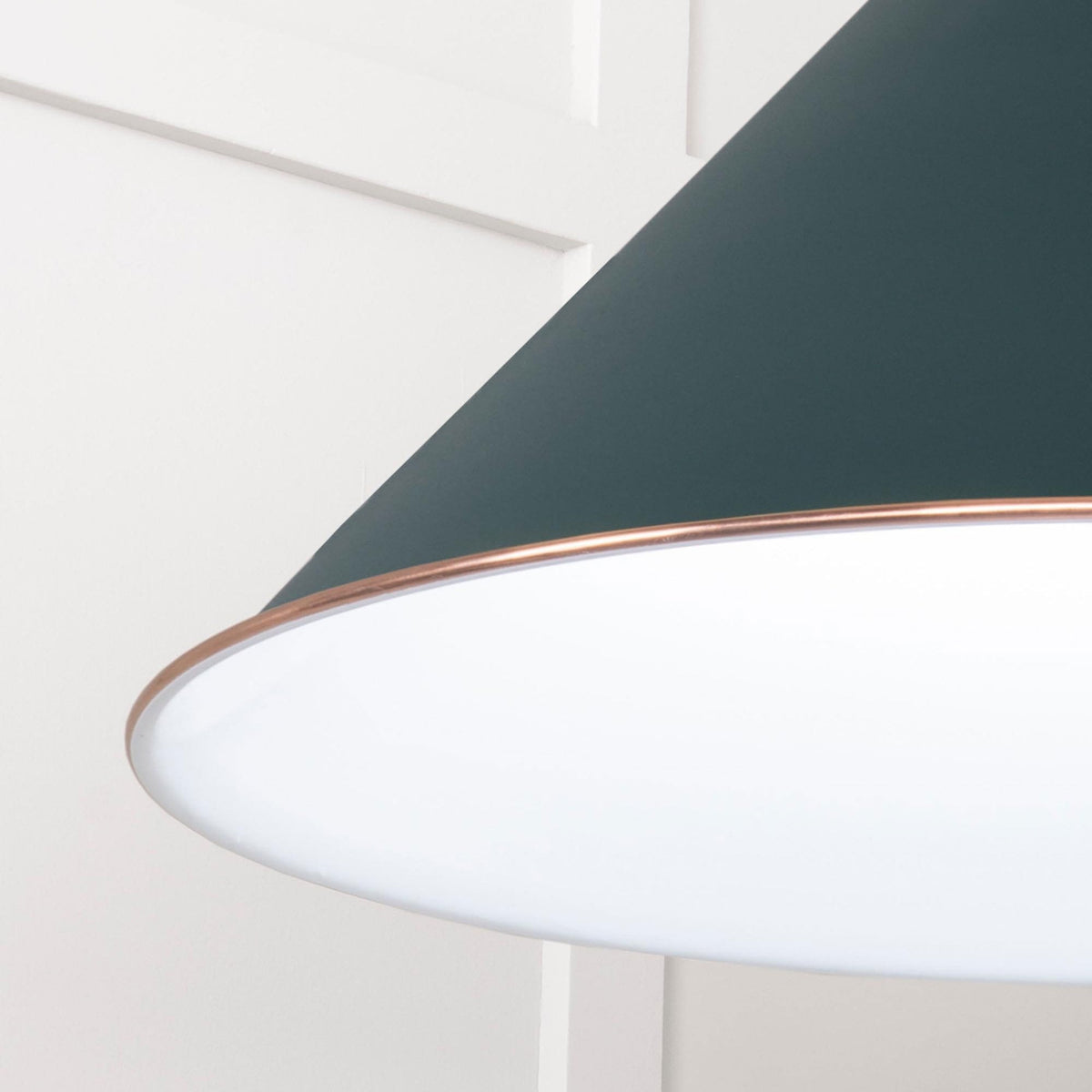 From the Anvil White Gloss Hockley Pendant in Dingle, close up of the dark green shade with copper trim