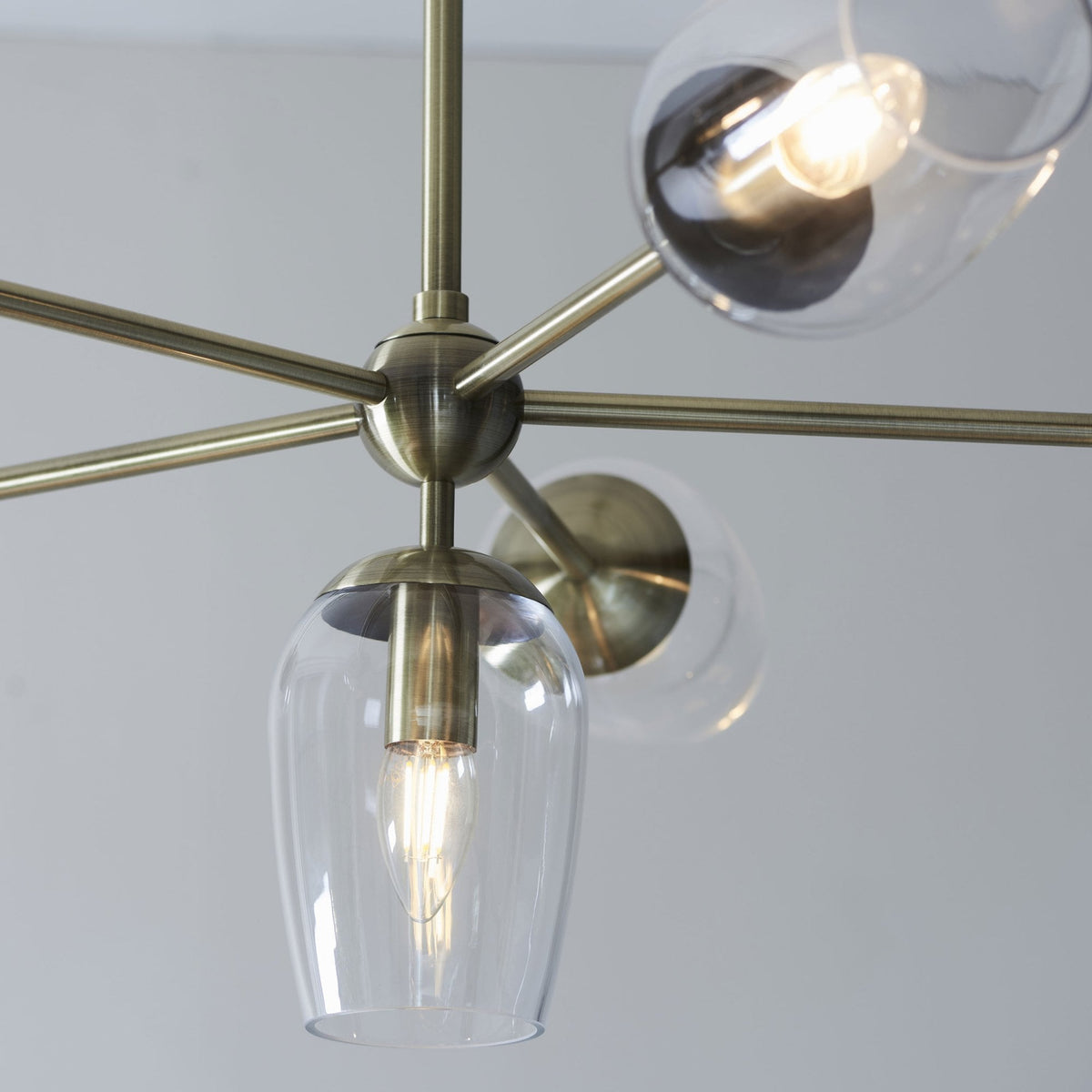Maeve Six Light Adjustable Stem Pendant in Antique Brass & Clear Glass