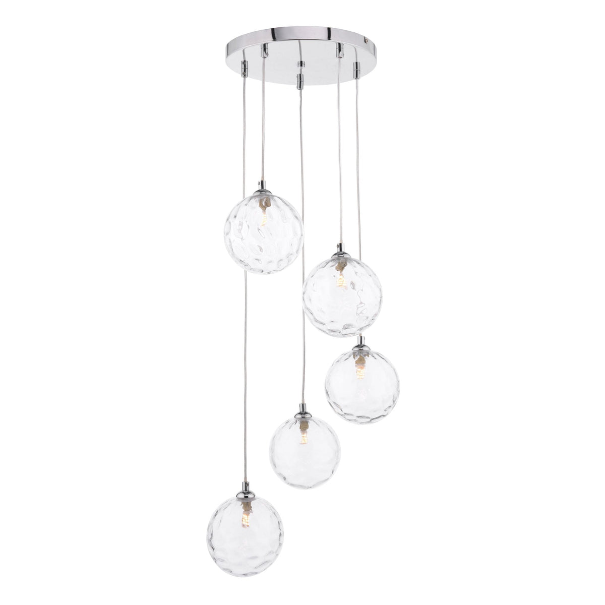 Five clear, textured glass globe pendant lights hang from a chrome ceiling plate.