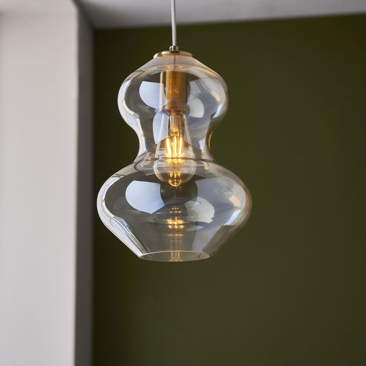 Kelda Shaped Single Pendant with Champagne Lustre Glass and Satin Brass Detailing