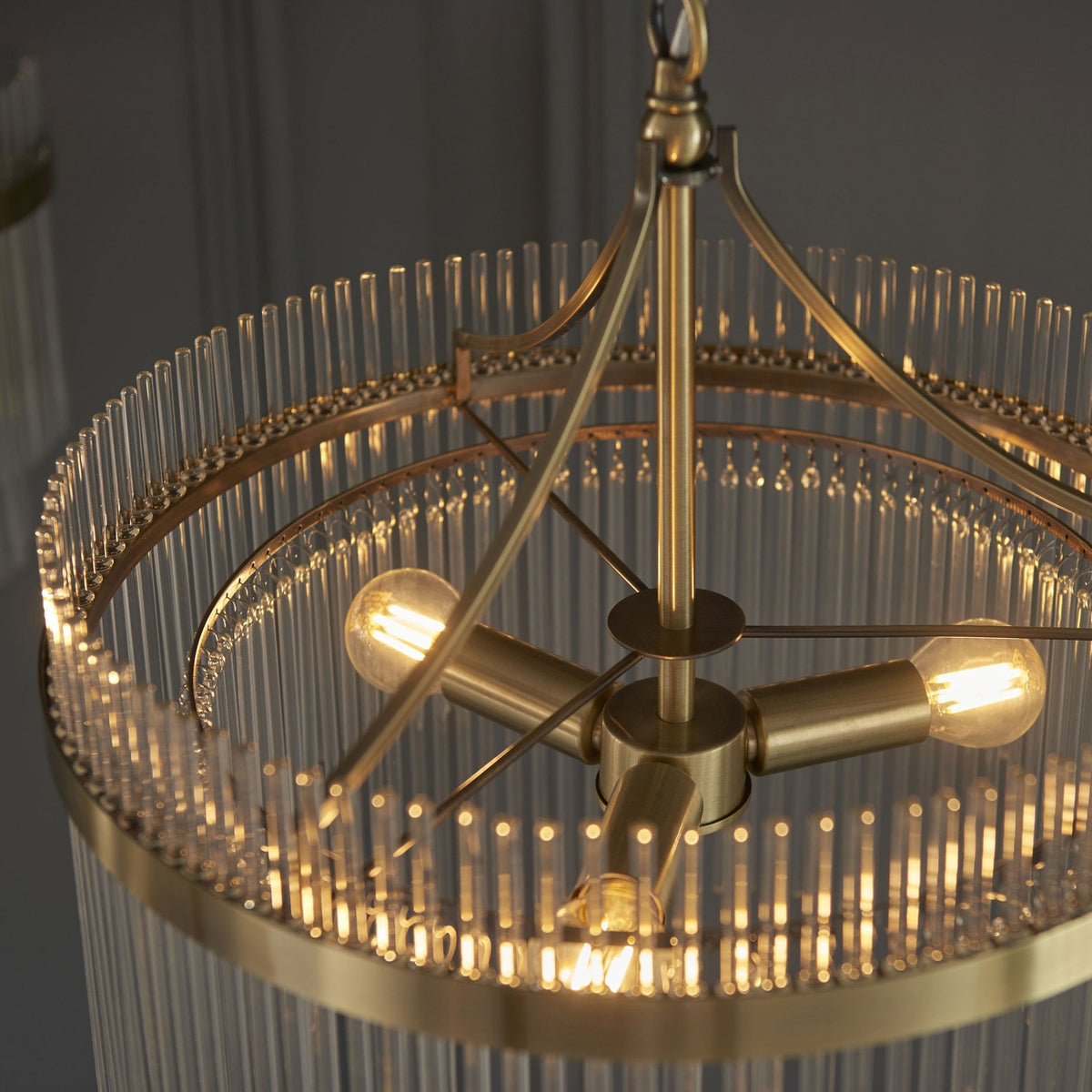 Marietta Three Light Pendant Chandelier in Antique Brass with Clear Glass Rods