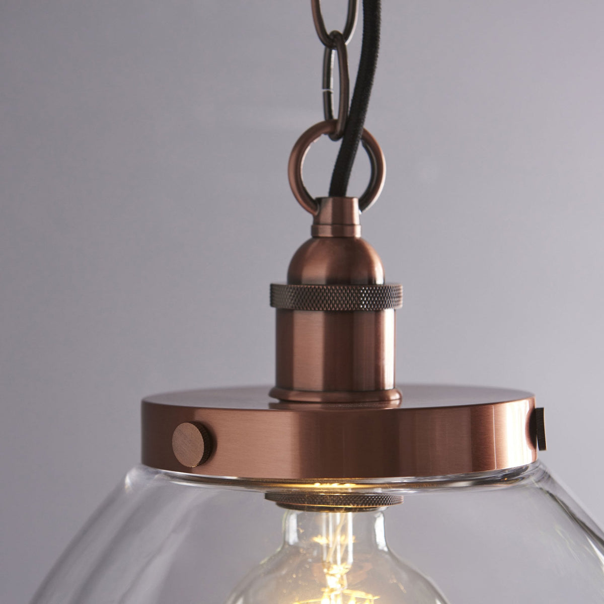 Hansen Grand Single Pendant in Aged Copper with Clear Glass Shade