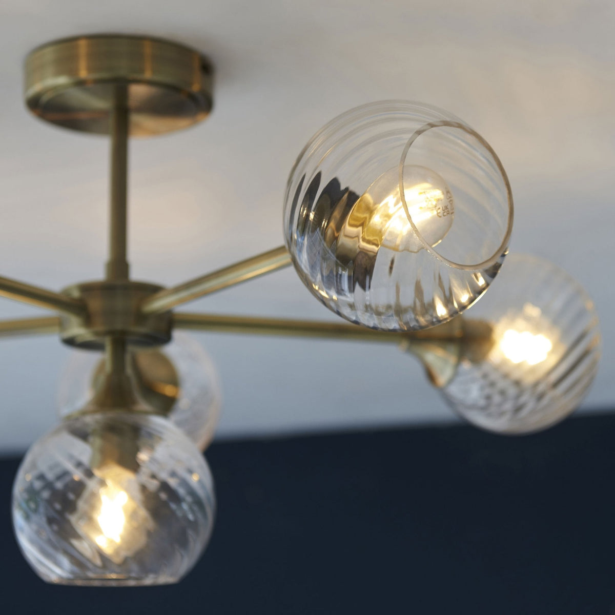 Allegra Six Light Semi Flush in Antique Brass with Twisted Glass Shades