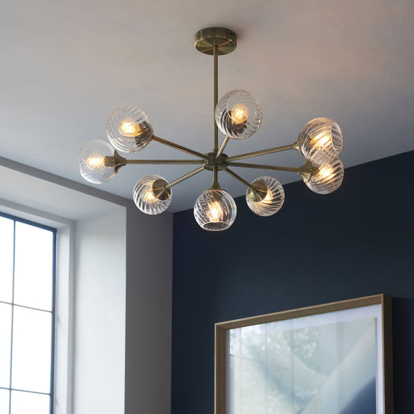 Allegra Eight Light Adjustable Height Semi Flush in Antique Brass with Twisted Glass Shades