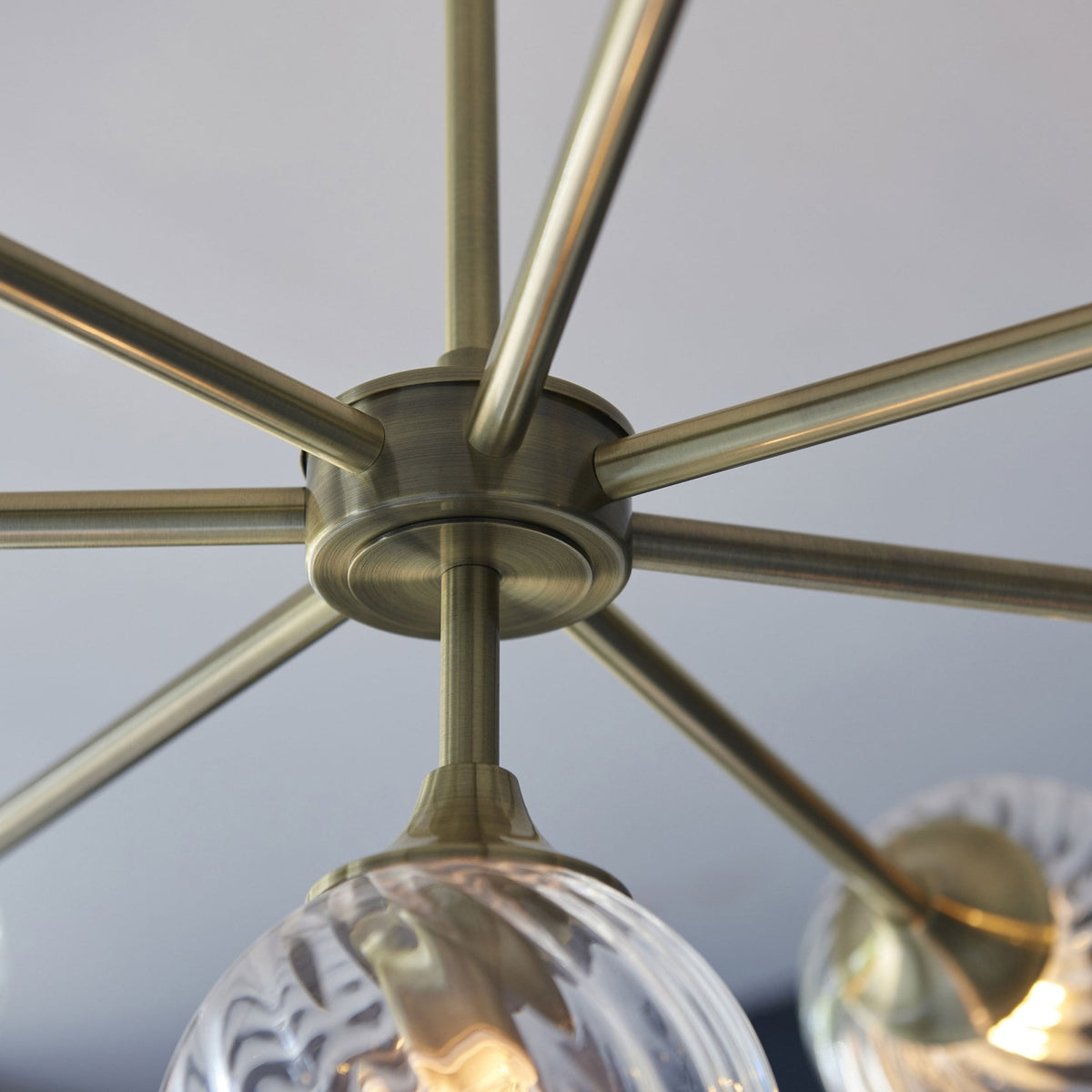 Allegra Eight Light Adjustable Height Semi Flush in Antique Brass with Twisted Glass Shades
