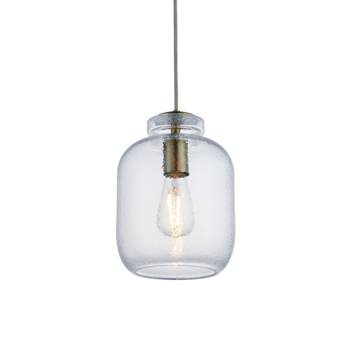 A clear, hammered glass pendant light with an antique brass cap on a white background.