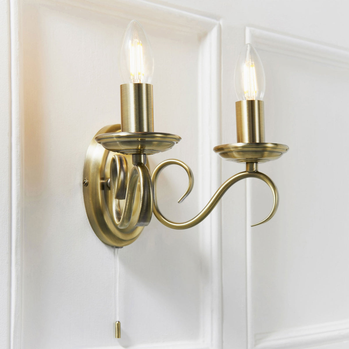 Bernice Two Arm Switched Wall Light in Antique Brass