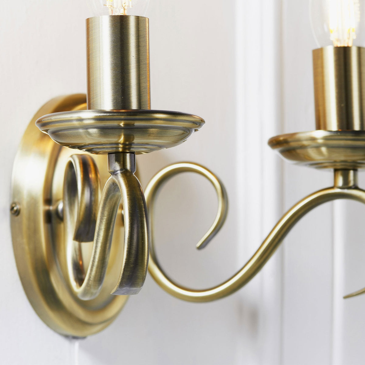 Bernice Two Arm Switched Wall Light in Antique Brass