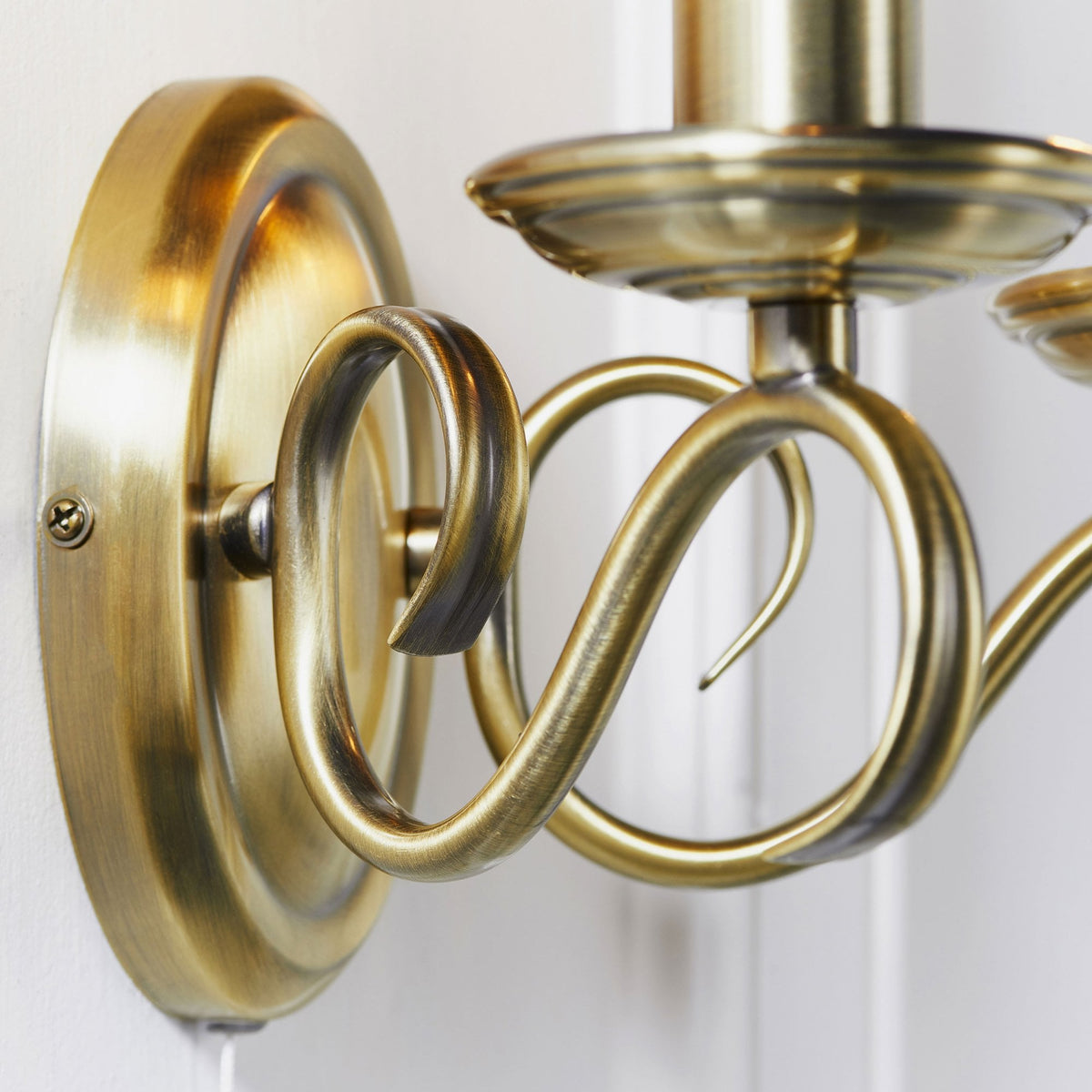 Bernice Two Arm Switched Wall Light in Antique Brass
