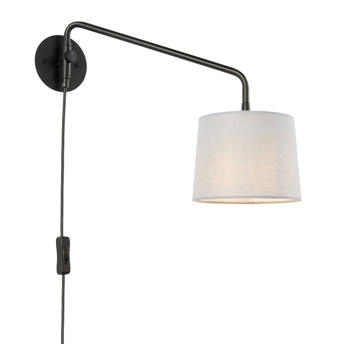 Black wall light with a white fabric shade and a visible power cord with an in-line switch.
