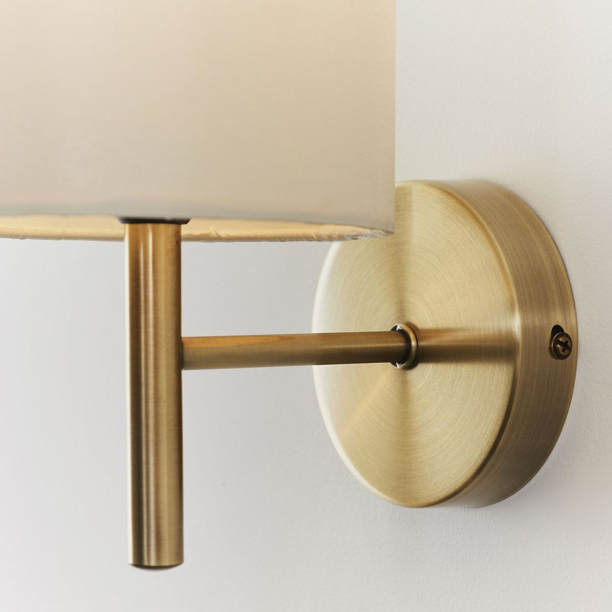 Brio Wall Light in Antique Brass with Cream Shade