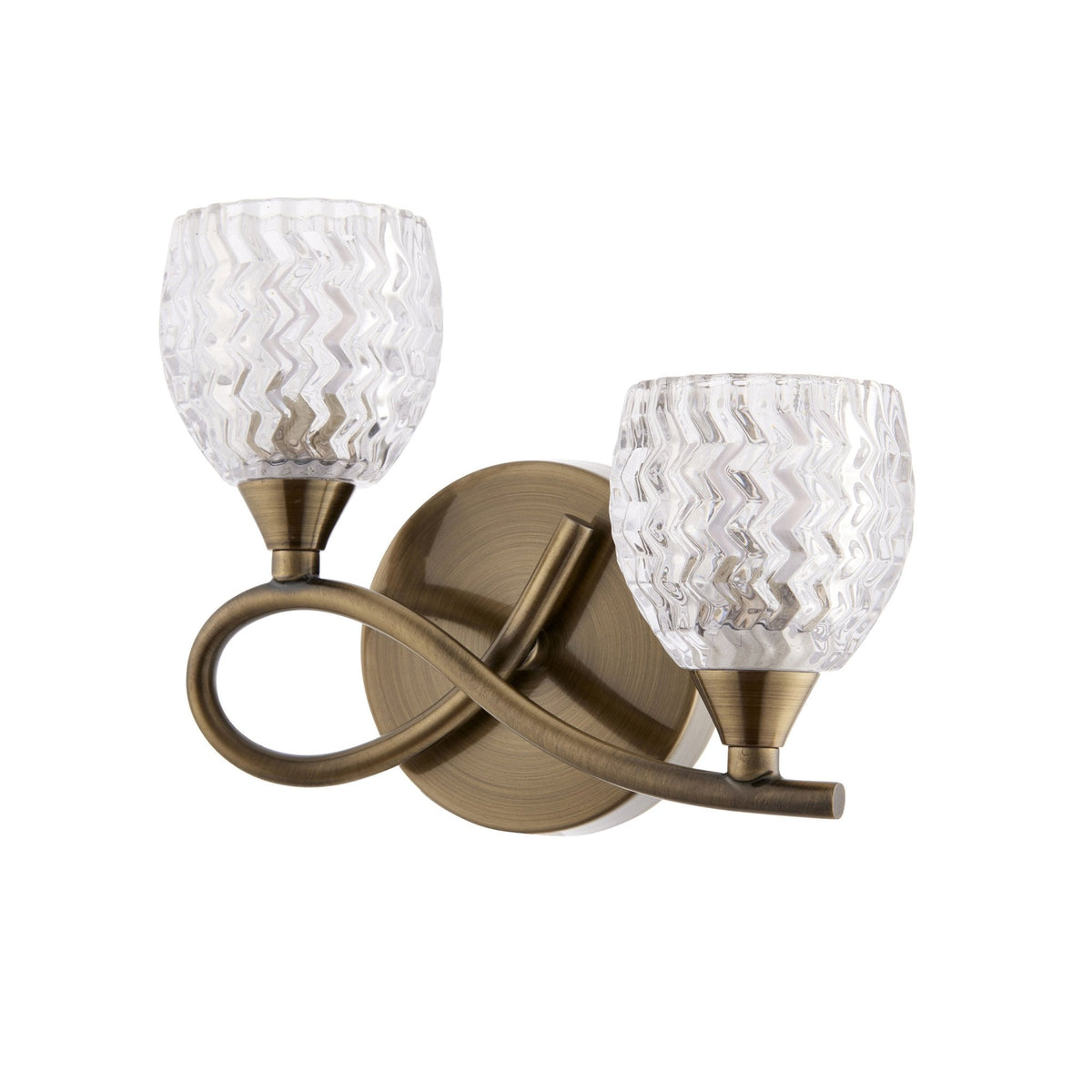 Two-light wall sconce with clear, textured glass shades and an antique brass finish on a white background.