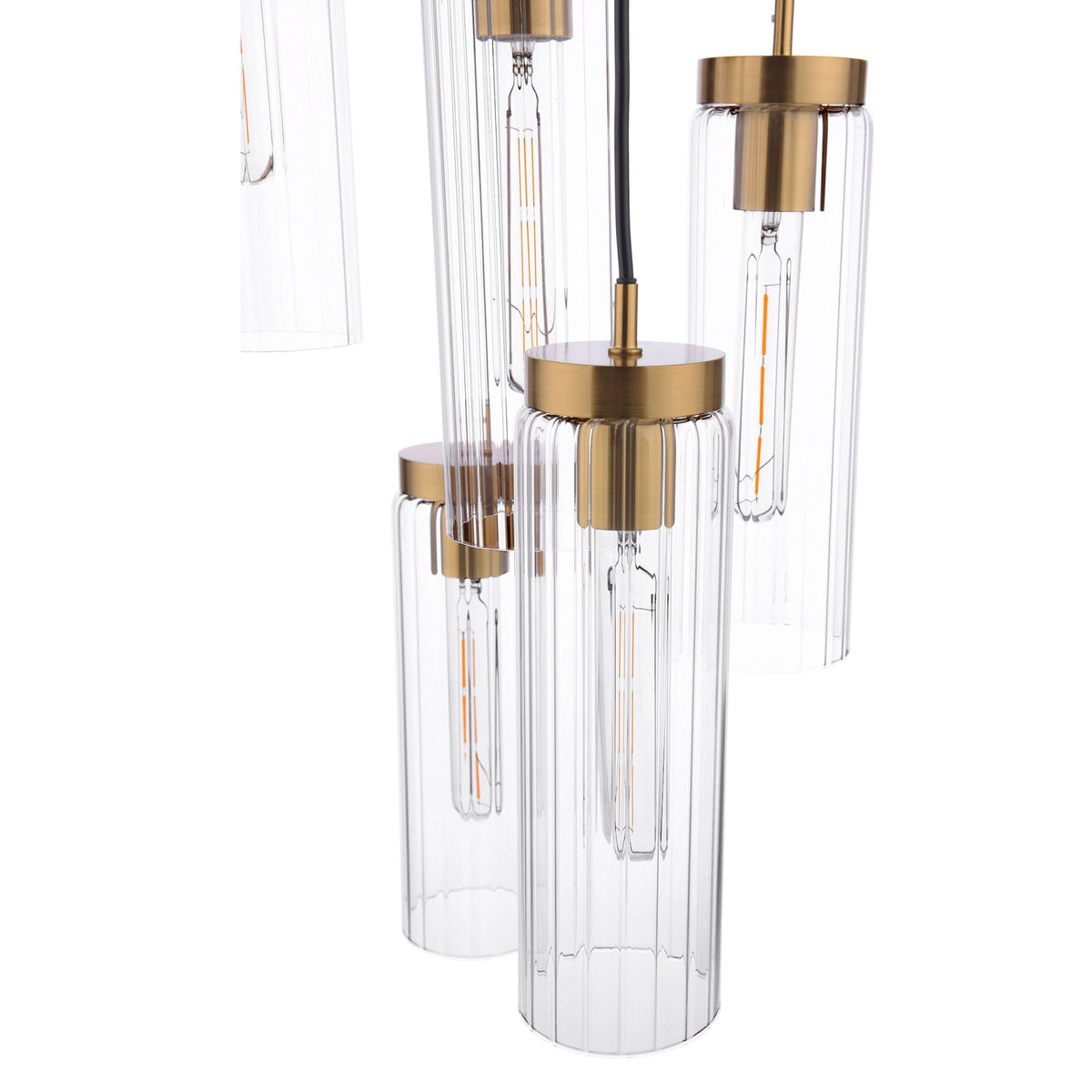 Close-up of a modern chandelier with multiple clear, ribbed glass shades and brass accents.