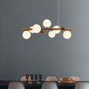 Ridge 7 Light Linear Pendant in Antique Copper with Opal & Copper Glass