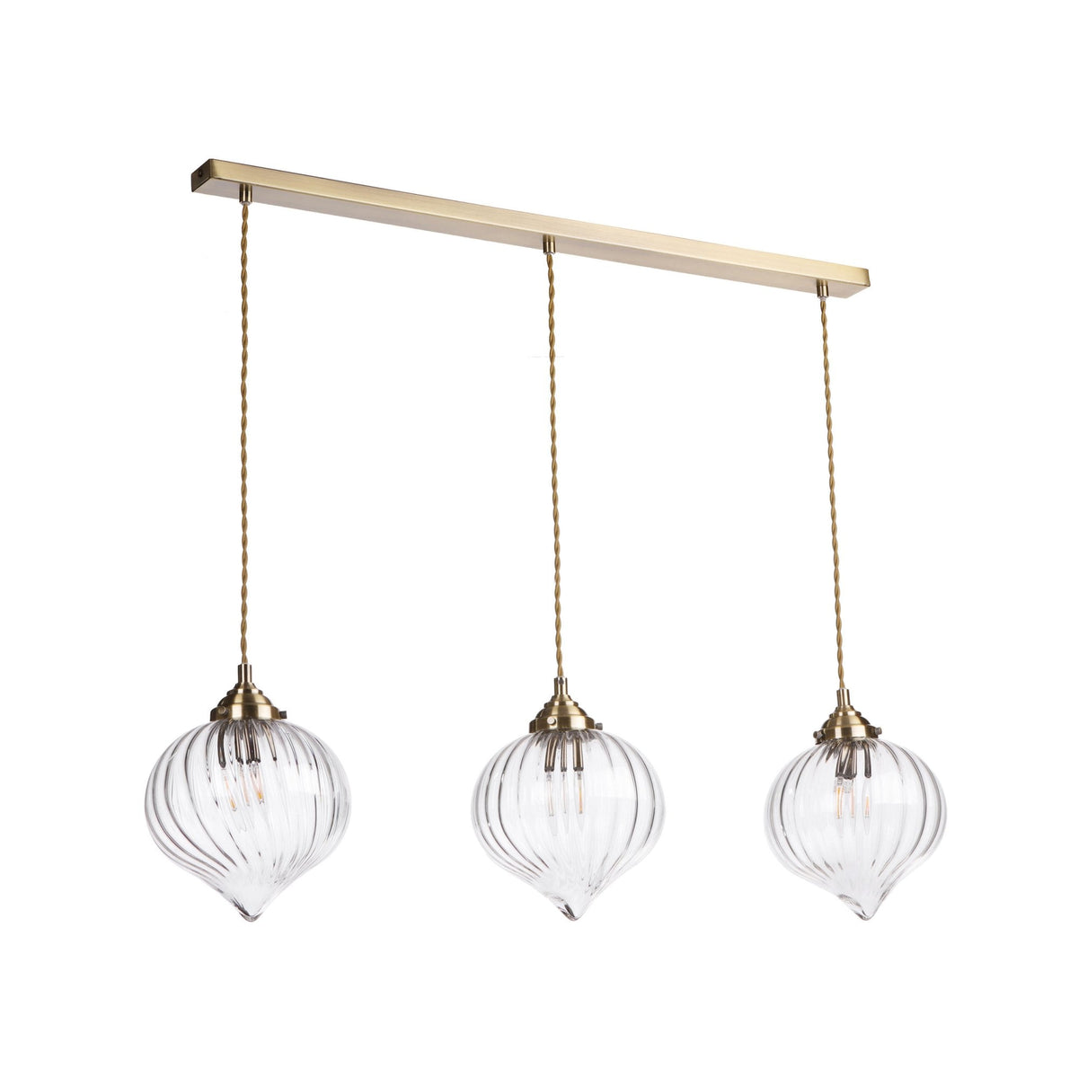 Three clear, ribbed glass pendant lights hang from a gold bar with twisted gold cords.