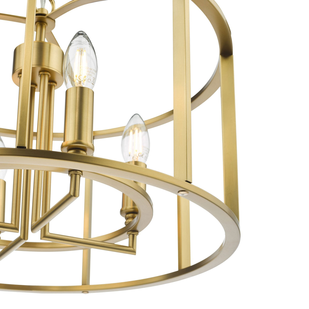 Close-up of a gold-colored chandelier with exposed light bulbs, featuring a caged design.